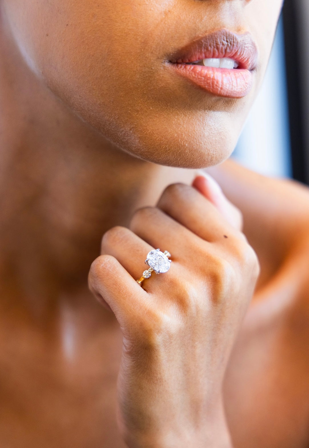 Floating Round Diamond Engagement Ring with Oval Cut Diamond