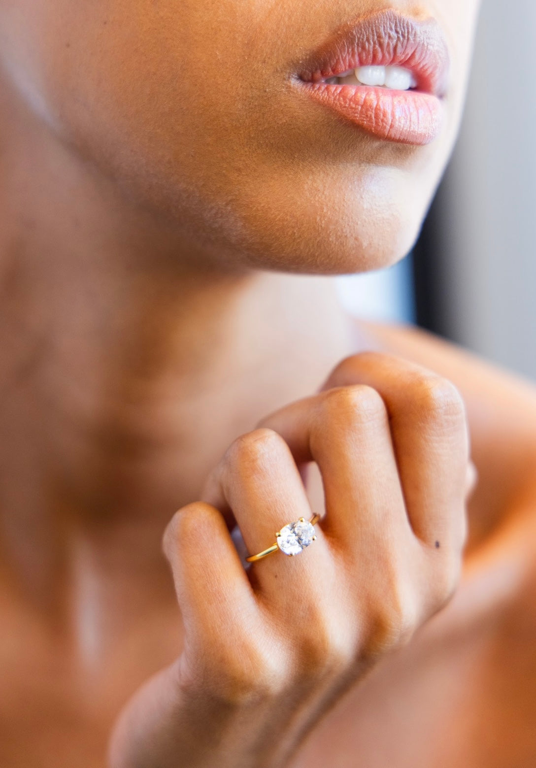 East West Engagement Ring with Oval Cut Diamond