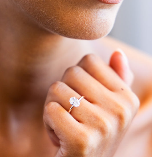 Tapered Solitaire Engagement Ring with Oval Cut Diamond