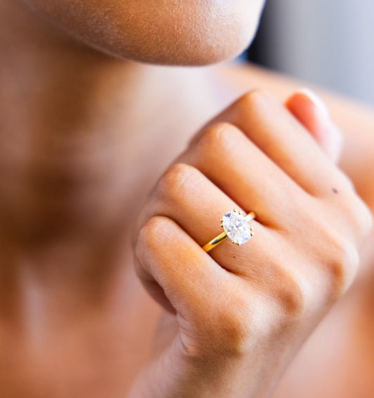 Double Claw Signature Solitaire Engagement Ring with Oval Cut Diamond