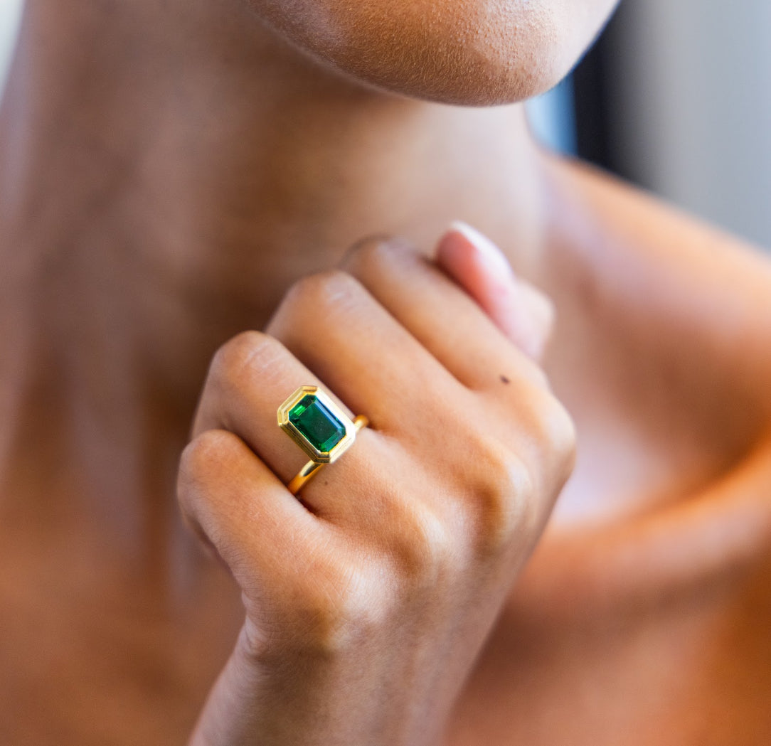 Floating Bezel Set Engagement Ring with Emerald Cut Diamond