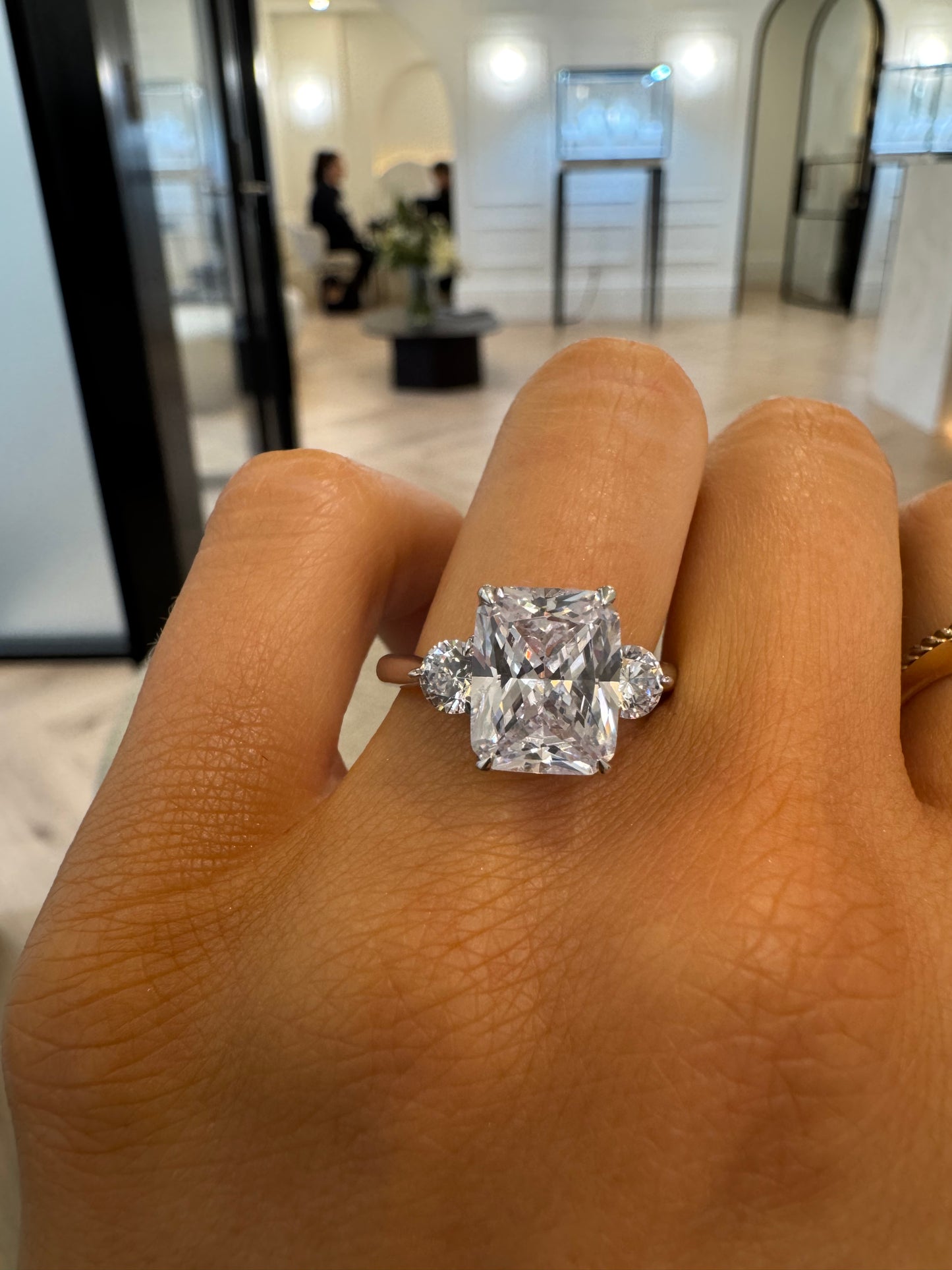 Round Trilogy Engagement Ring with Radiant Cut Diamond