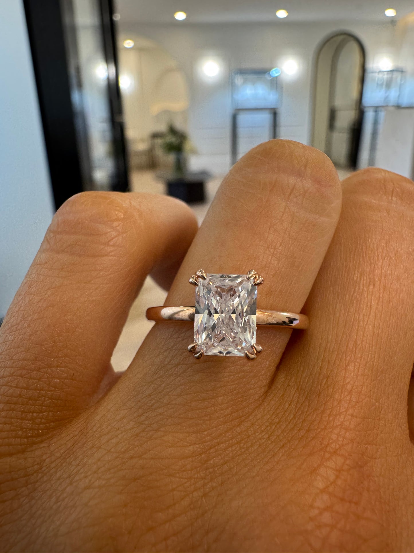 Double Claw Signature Solitaire Engagement Ring with Radiant Cut Diamond