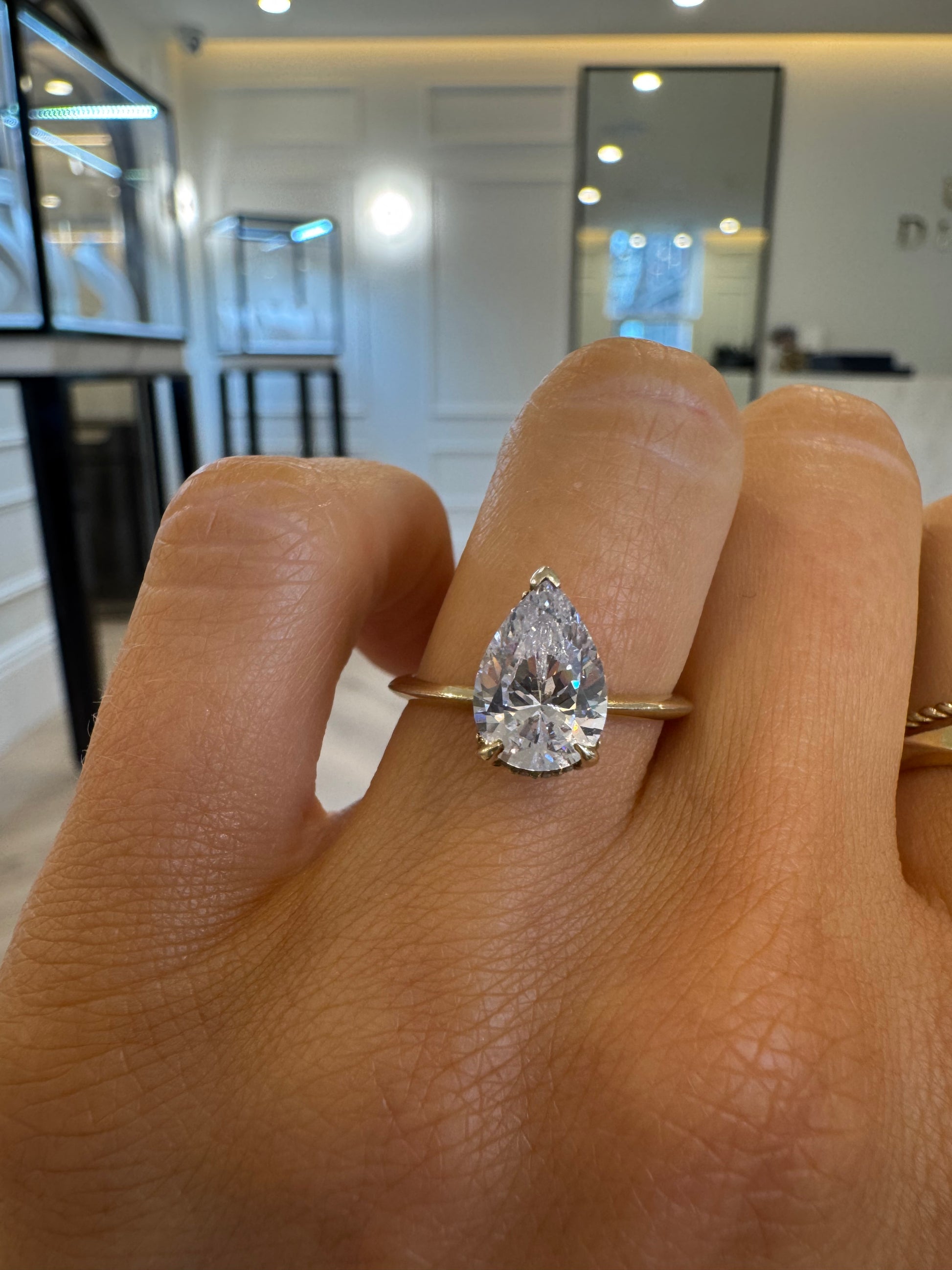 Knife Edge Solitaire Engagement Ring with Pear Cut Diamond