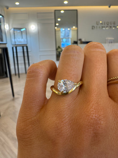 East West Curved Engagement Ring with Pear Cut Diamond