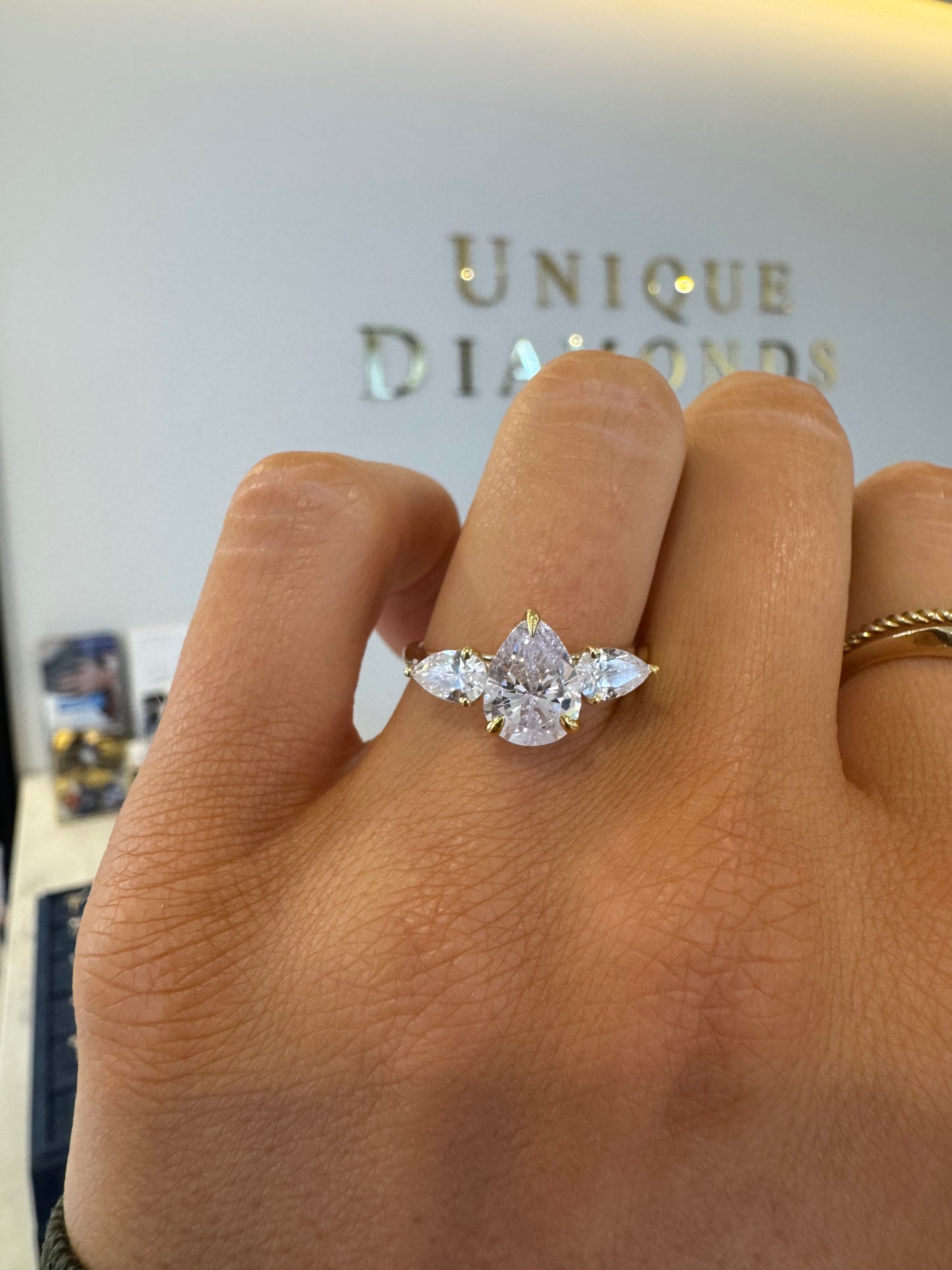 Three Stone Engagement Ring with Pear Cut Diamonds
