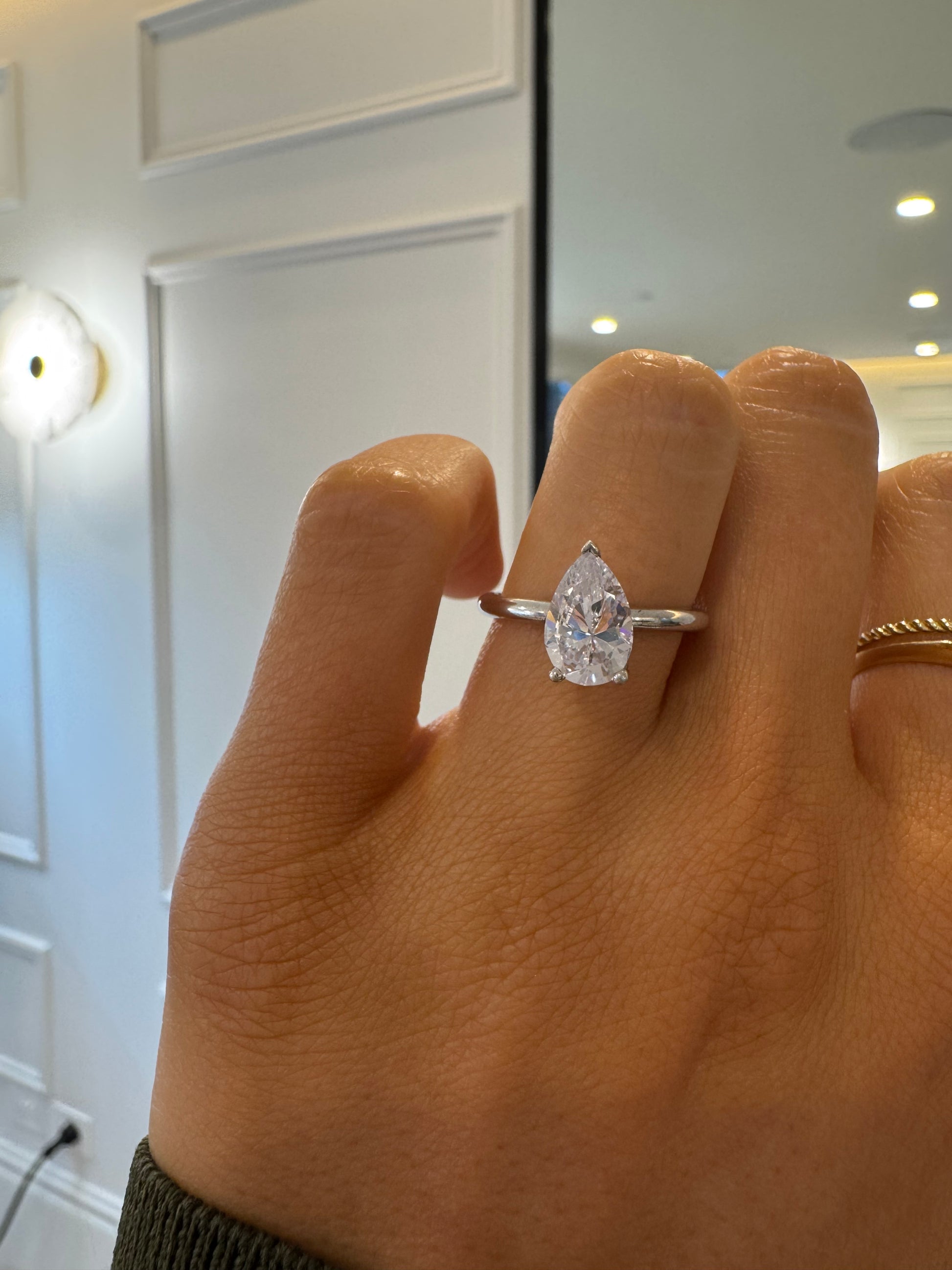 Signature Solitaire Engagement Ring with Pear Cut Diamond