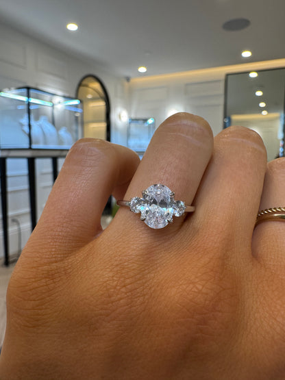 Round Trilogy Engagement Ring with Oval Cut Diamond