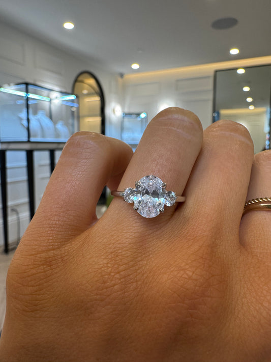 Round Trilogy Engagement Ring with Oval Cut Diamond