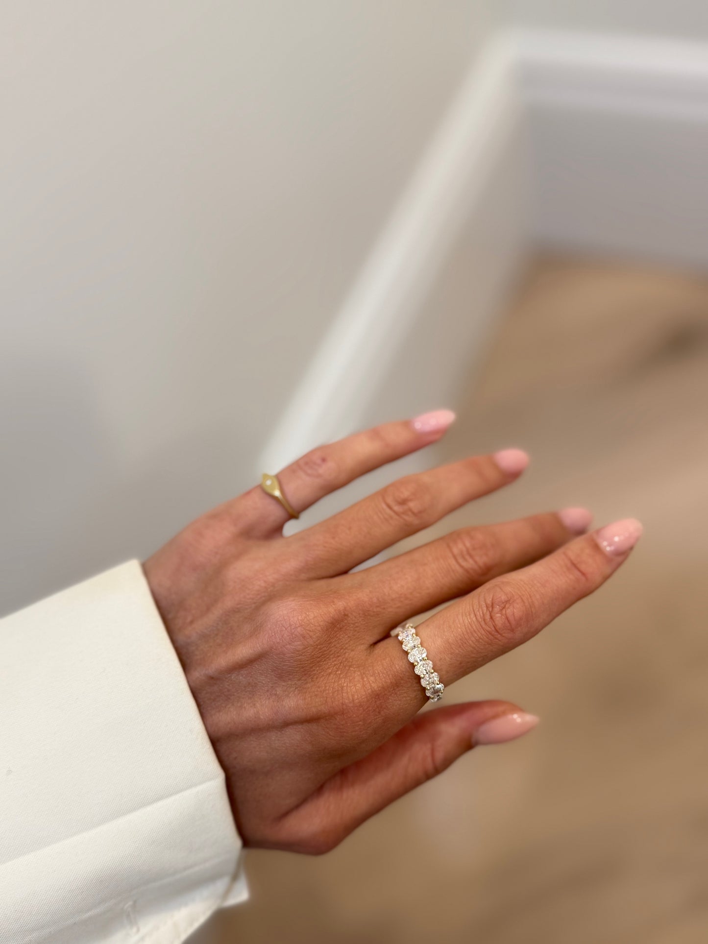 Shared Prong Band With Oval Cut Diamonds