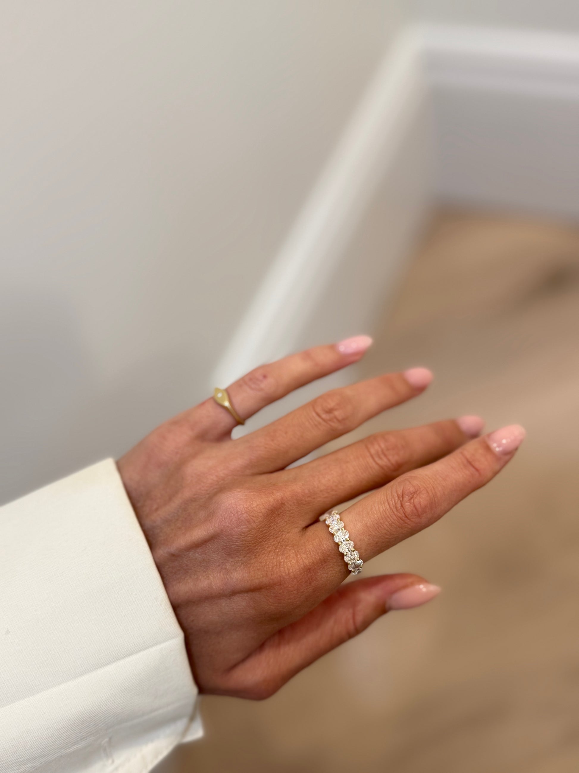 Shared Prong Band With Oval Cut Diamonds