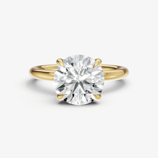 Round Four Claw Solitaire Engagement Ring