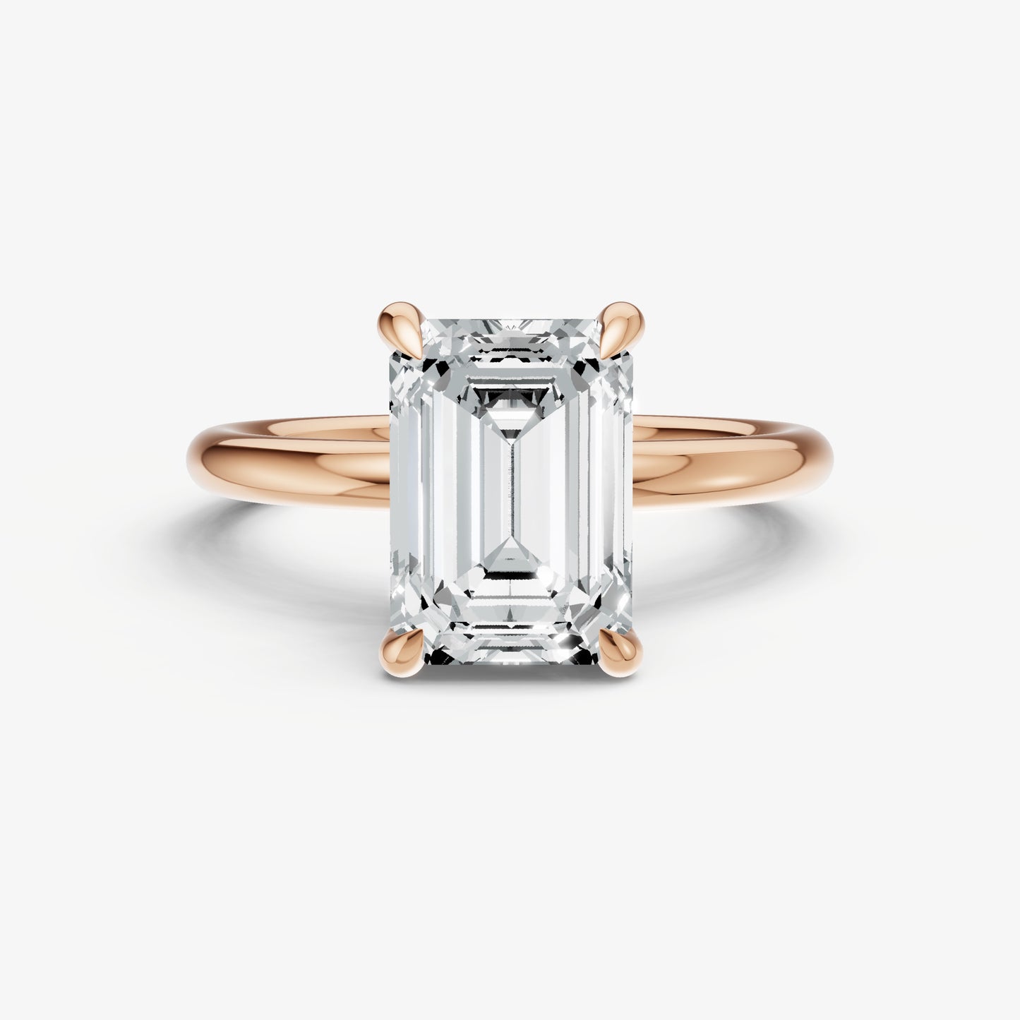 Emerald Four Claw Solitaire Engagement Ring with Hidden Halo