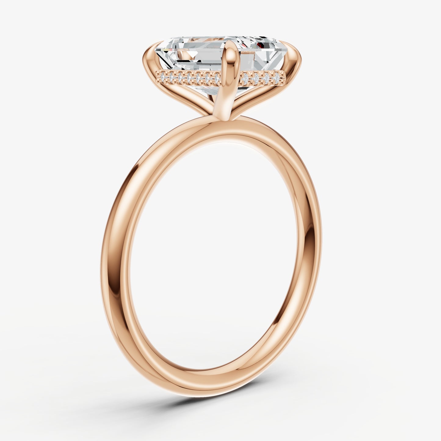 Emerald Four Claw Solitaire Engagement Ring with Hidden Halo