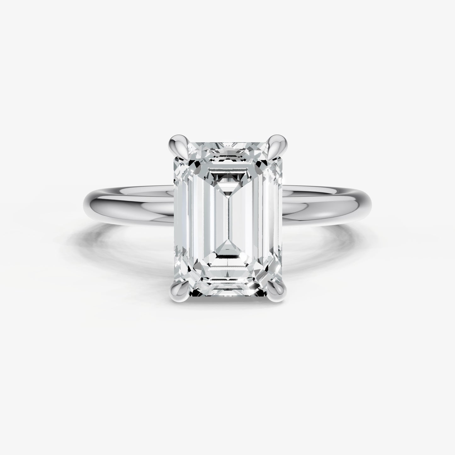 Emerald Four Claw Solitaire Engagement Ring with Hidden Halo