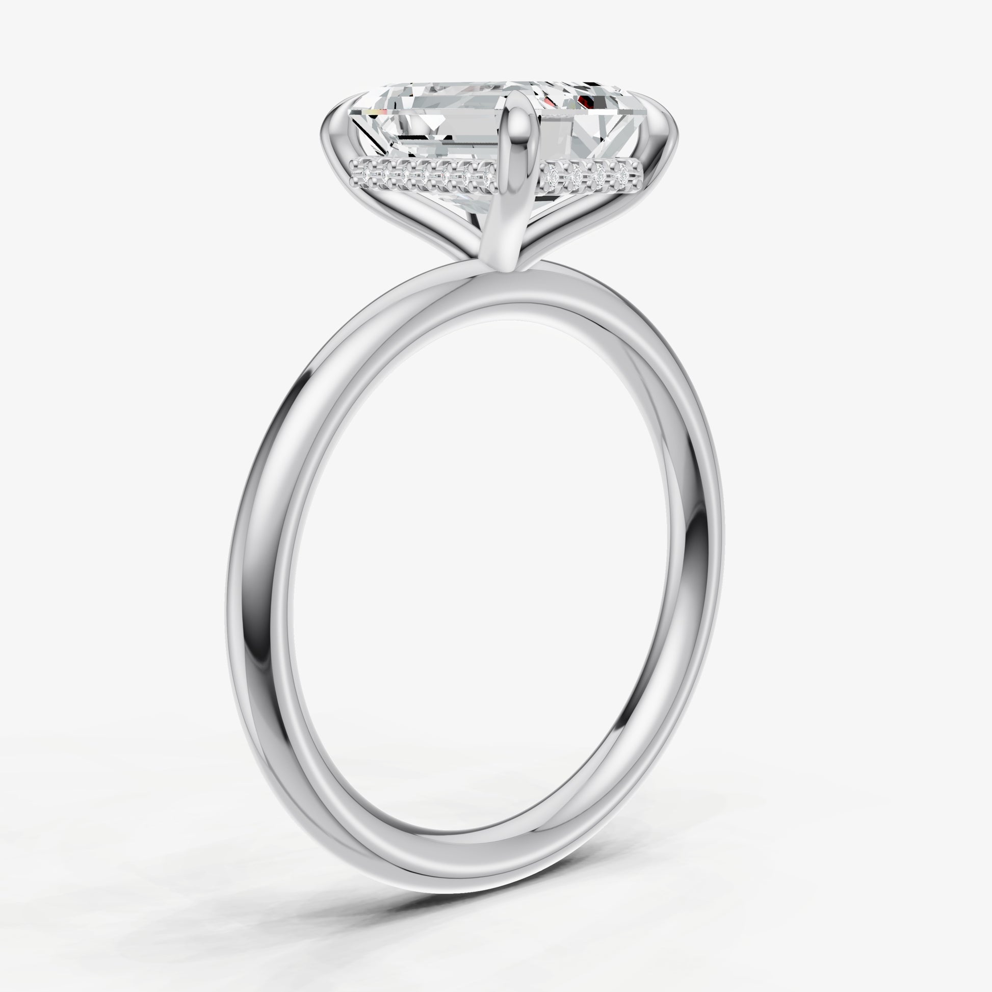 Emerald Four Claw Solitaire Engagement Ring with Hidden Halo