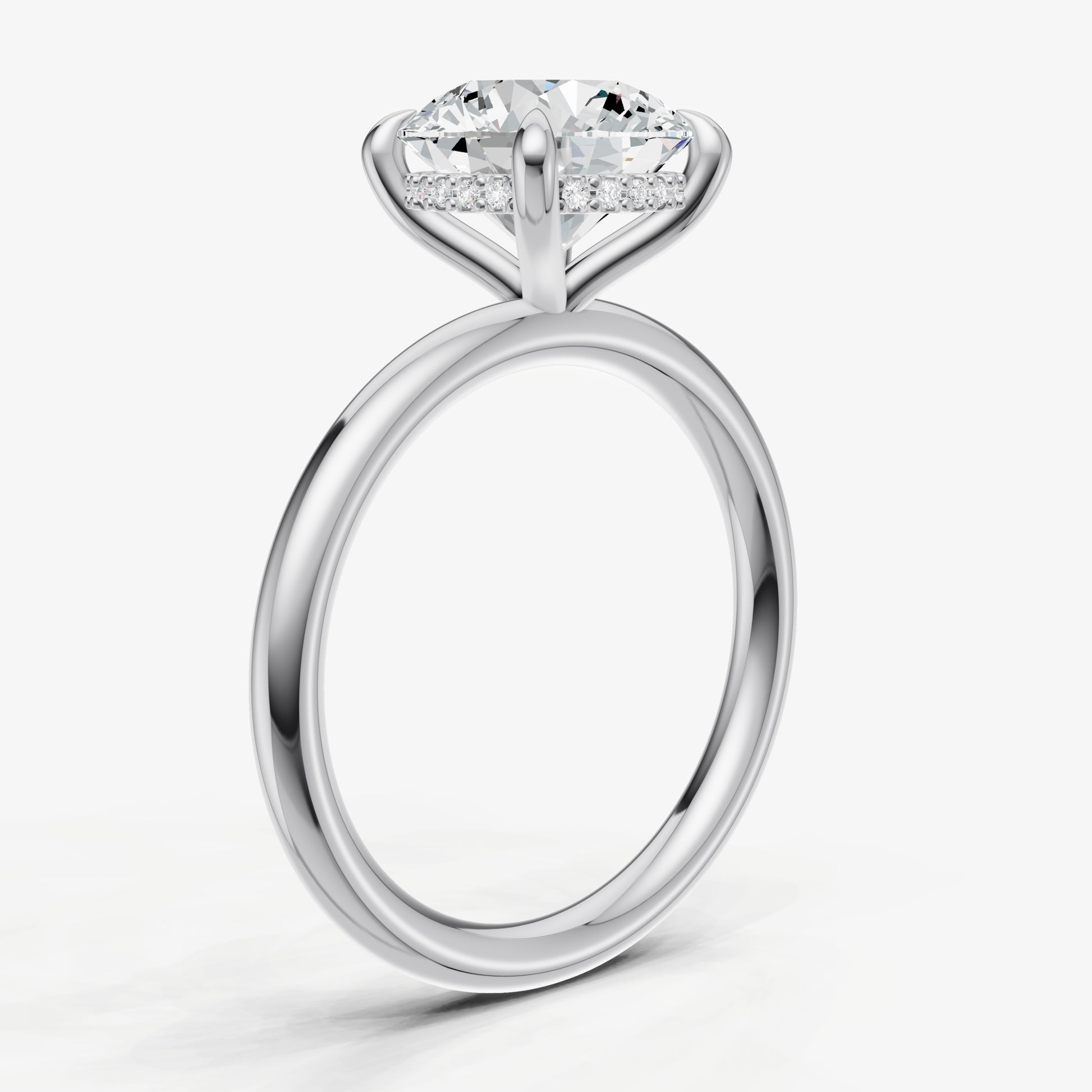 Round Four Claw Solitaire Engagement Ring with Hidden Halo