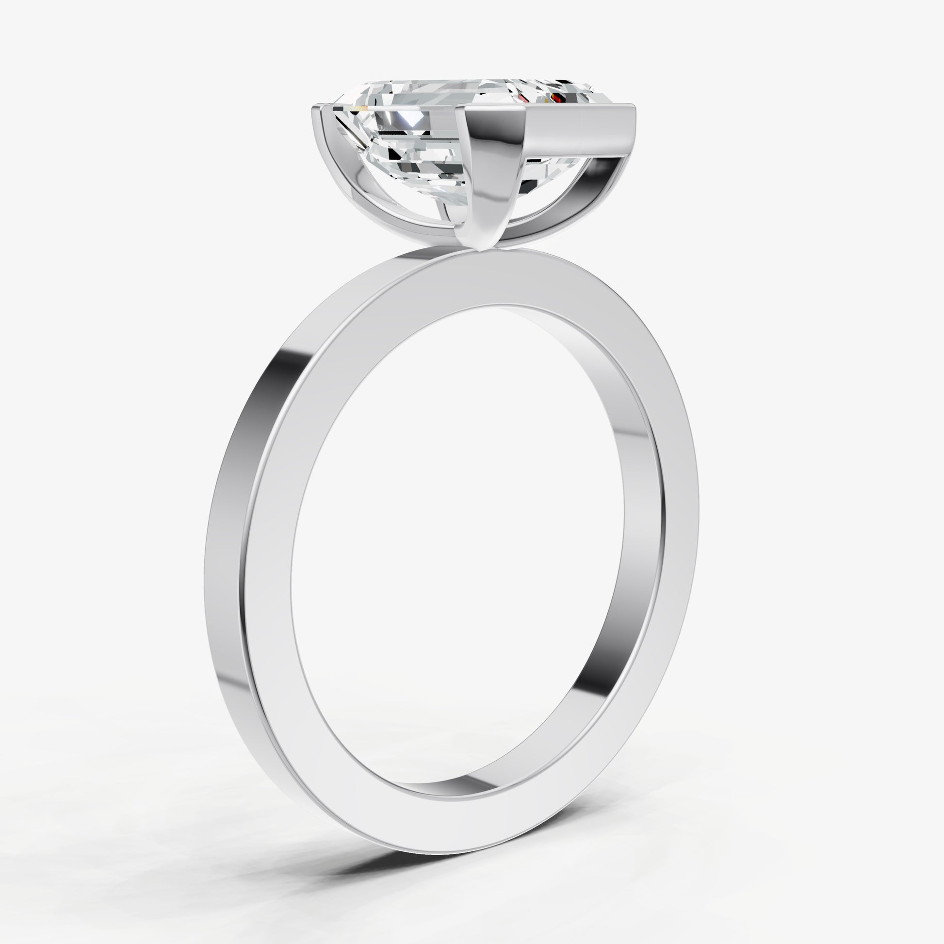 Emerald Bezel Set Solitaire Engagement Ring