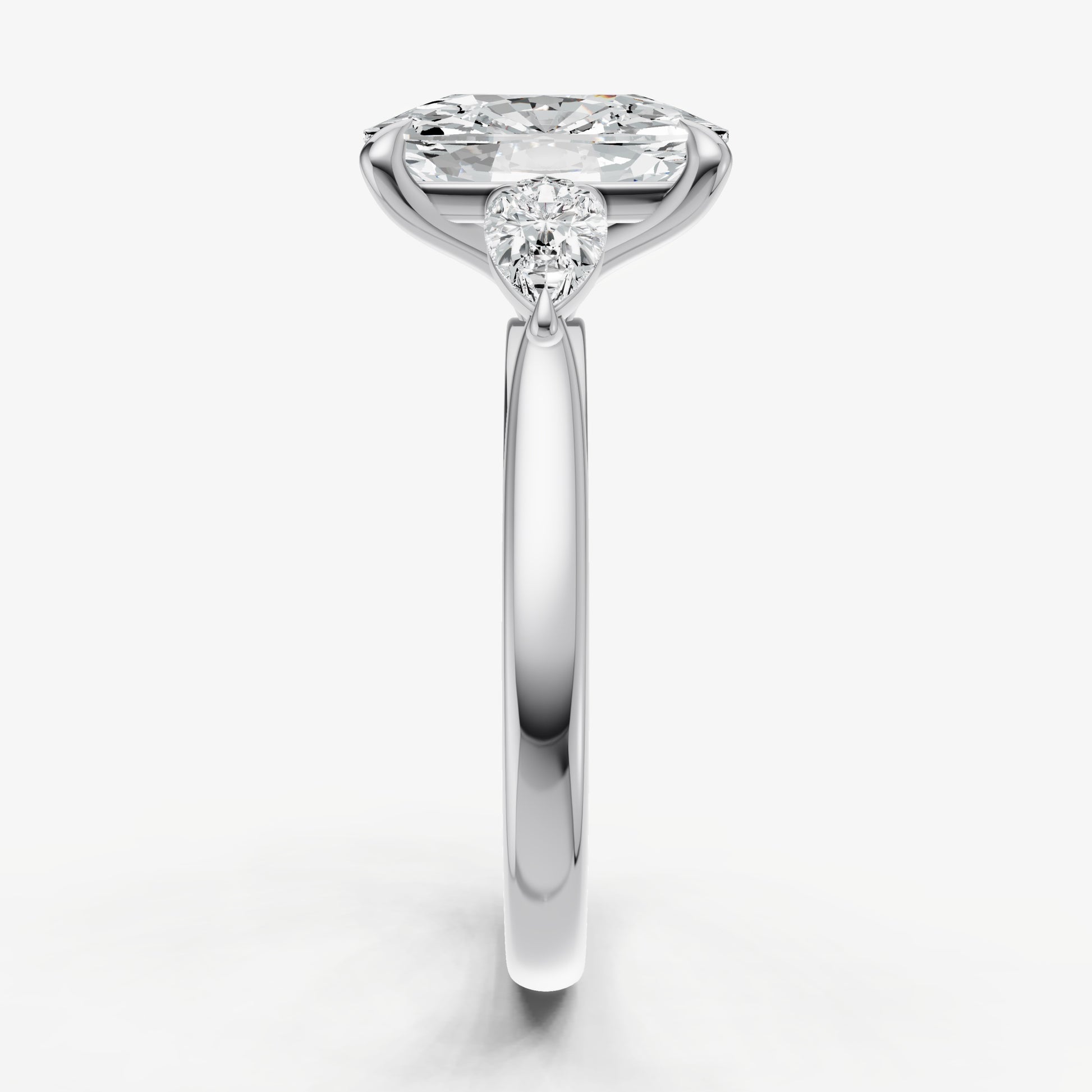 Elongated Cushion Engagement Ring with Pear Side Diamonds
