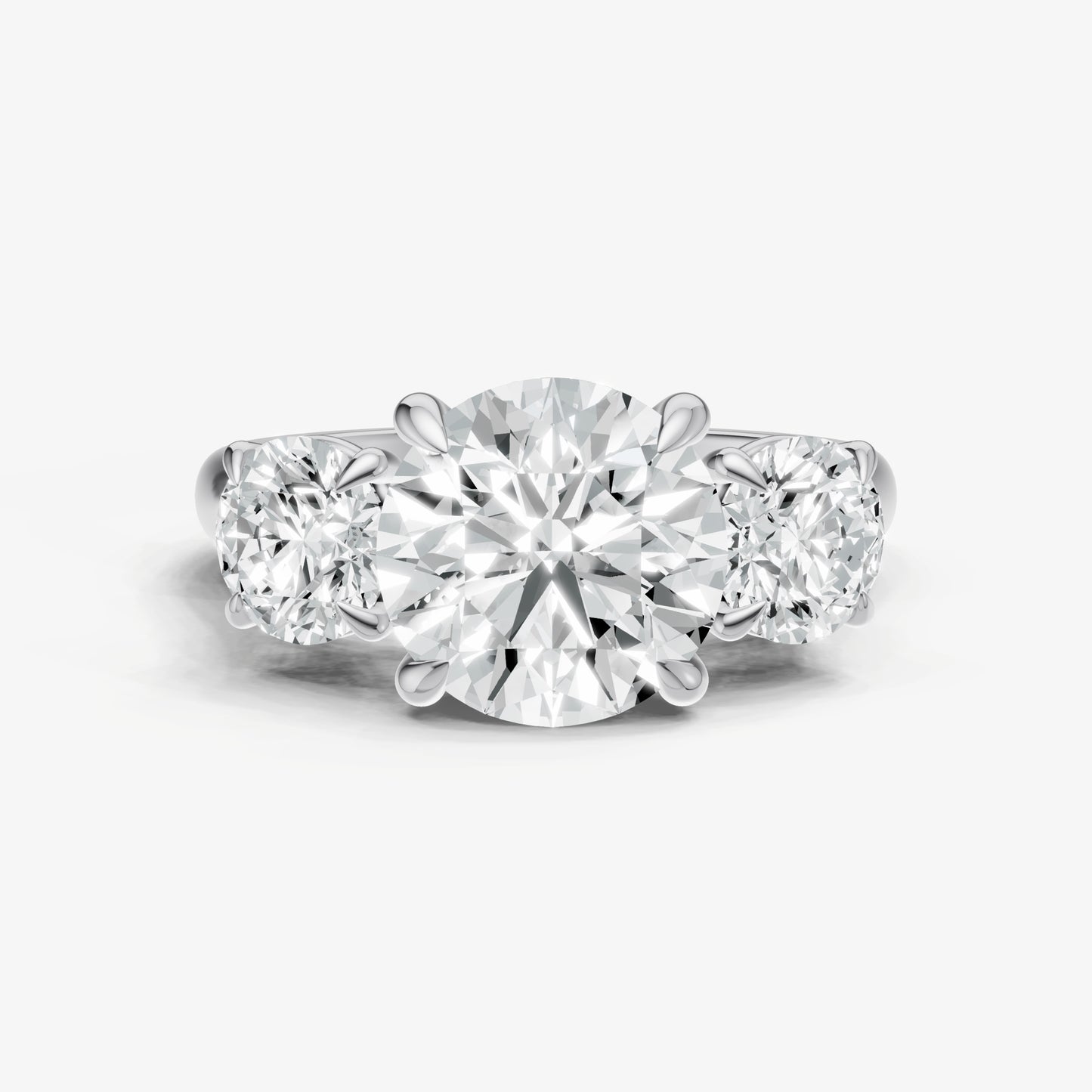 Round Trilogy Diamond Engagement Ring with 0.50ct Side Stones