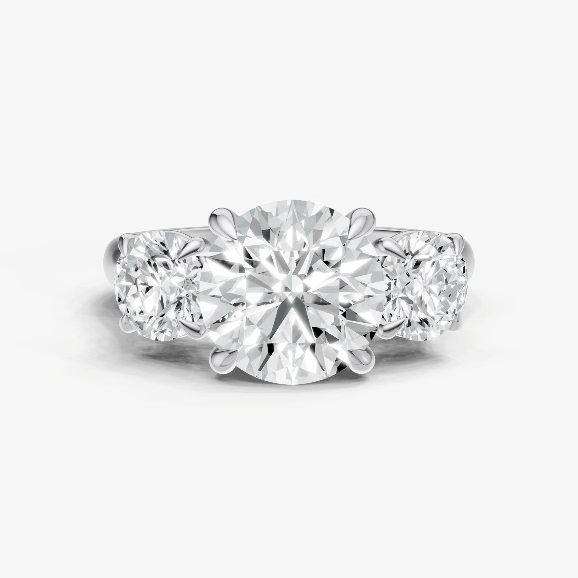 Round Trilogy Diamond Engagement Ring with 0.50ct Side Stones