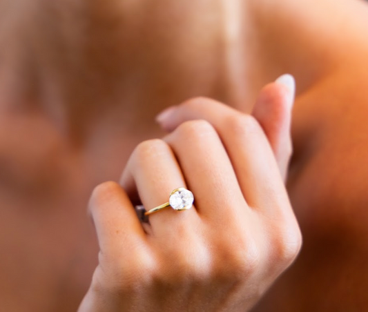 East West Half Bezel Engagement Ring with Oval Cut Diamond